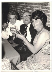 Three people at an event.
