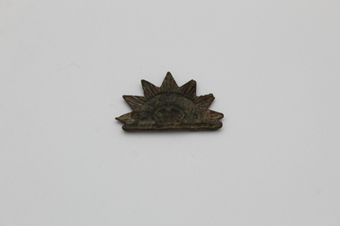 Badge - Rising Sun badge, Australian Rising Sun hat badge (no pin). Boer War. Tagged "First hat badge"