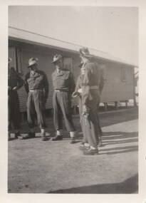 Photograph - Black and white photograph, 5 unknown soldiers outside barracks
