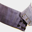 Navy blue Cummerbund showing three rows of three black buttons and button holes for fastening