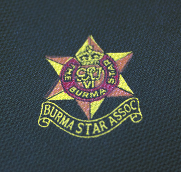 Printed 6 pointed star emblem in yellow and red on green tie. Yellow printed scroll at base of the star reads: Burma Star Assoc