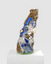 A colourful, irregularly shaped sculpture with metallic sections. There is an eye-like shape on the left-hand side and several shiny metallic sections which look similar to fish scales or bird feathers. 