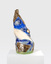 A colourful, irregularly shaped sculpture with metallic sections. There is an eye-like shape on the right-hand side, a large white section and several shiny metallic sections which look similar to fish scales or bird feathers. 