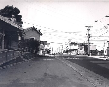 Looking along Highett Road, Highett, across the railway crossing.