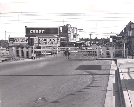 The level crossing gates at the McKinnon crossing are closed.