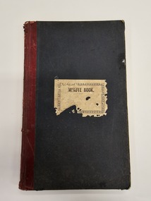 Green, hard cover minute book with red leather binding on the spine.