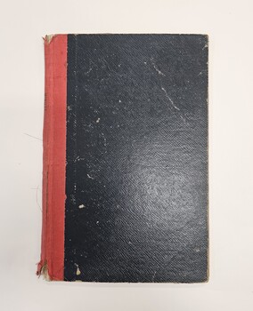 Black hard cover book with red spine
