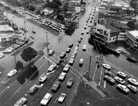 Busy traffic weaves through the intersection 
