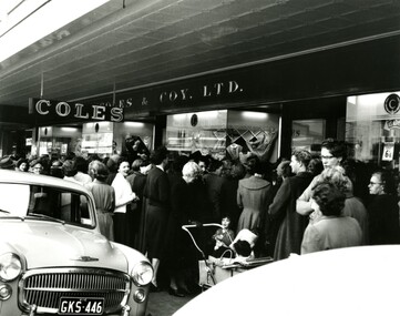 Women crowd around the entrance to the Coles store which is newly opened in Bentleigh
