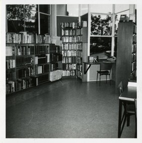 A view of a library interior, including two desks