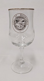 Wine glass with gold edge and City of Moorabbin logo printed in gold