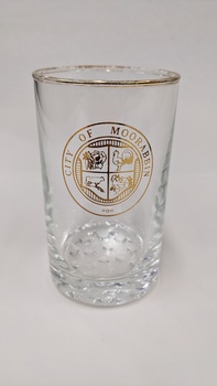 Water glass with gold edge and City of Moorabbin logo printed in gold