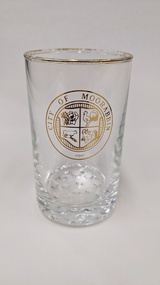 Water glass with gold edge and City of Moorabbin logo printed in gold