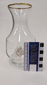 Wine glass with gold edge and City of Moorabbin logo including Nautical Archaeology scale to 8cm placed against right side