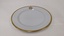 White entree plate with gold edging and City of Moorabbin logo 