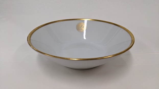 White dessert bowl with gold edging and City of Moorabbin logo 