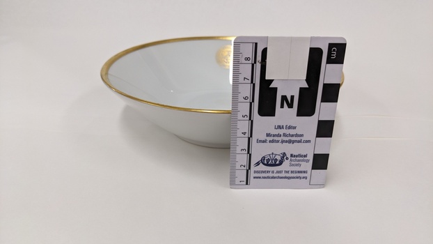 White dessert bowl with gold edging and City of Moorabbin logo with scale to 8cm placed against the right-hand side