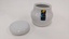 Small white sugar bowl with purple, green and yellow Moorabbin Arts Centre Logo with lid removed and placed to left
