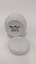 Base of small white sugar bowl with lid removed and placed at front