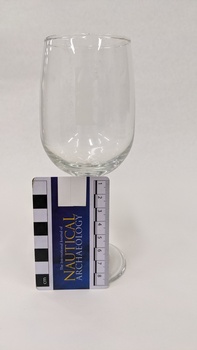 Red wine glass with white Kingston Arts logo printed on it with scale to 8cm placed to the left.