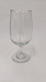 Beer glass with white Kingston Arts logo printed on front