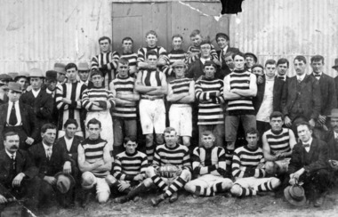 A group of players and supporters of Moorabbin Football Club