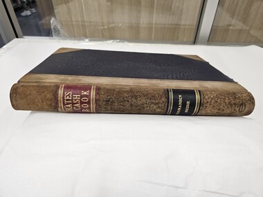 Suede and linen bound book with Rates Cash Book Moorabbin Shire in gold text along the spine