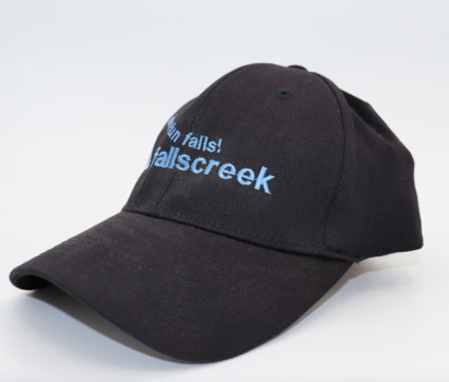 Side view of  bearing a blue and white Falls Creek advertising logo