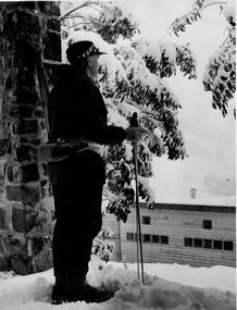 Fred Griffith on the left of the image with ski poles in hands