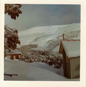 A view from Bowna looking towards the summit. Snow covered buildings on both sides of the photo