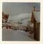A view from Bowna looking towards the summit. Snow covered buildings on both sides of the photo