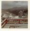 Looking towards the lower car park from balcony. Snow covered hills and threatening sky.