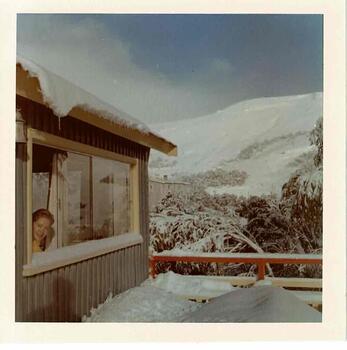 Bowna Lodge with a woman looking out of the window in the left foreground.