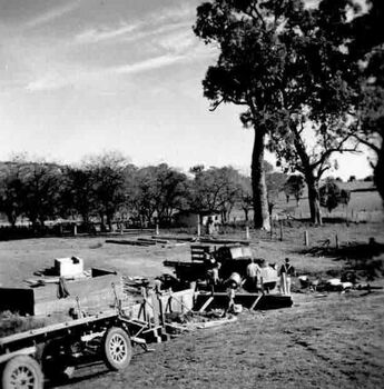 Work in progress including volunteers with truck and cement mixer