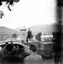Views towards Frying Pan. People and a car in the foreground. Location unknown.
