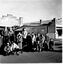 Group of members standing in front of beauty salon, possibly in Hotham.