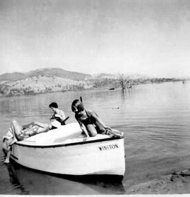 Relaxing on a boat at the Hume weir in 1953, probably near Fred Griffith's property "Toonalook"