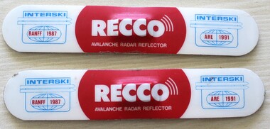 Two Recco Avalanche reflectors with brand in the centre.