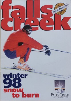 A skier dressed in red and blue clothing in a crouch position.