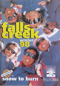 A group of skiers looking at the camera from above