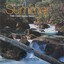 Image of a mountain stream with the Falls Creek logo
