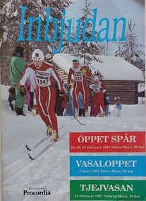 A group of cross country skiers with a cabin and trees in the background
