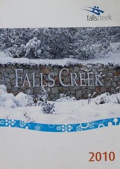 Image of Falls Creek spelled out in white letters on a stone wall.