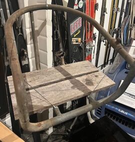 Chair made from wood and metal poles