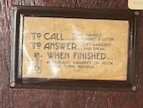 Instructions attached to the front of the telephone