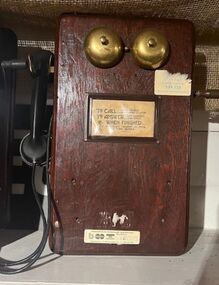 Telephone with instructions on use attached.
