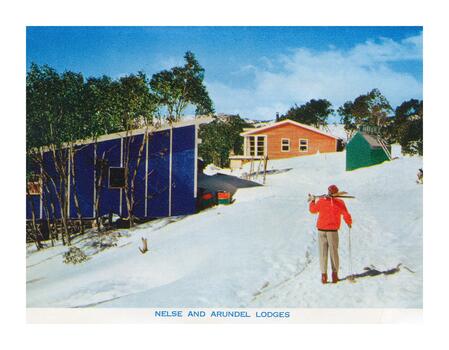 A skier walking up the slope to Nelse and Arundel Lodges