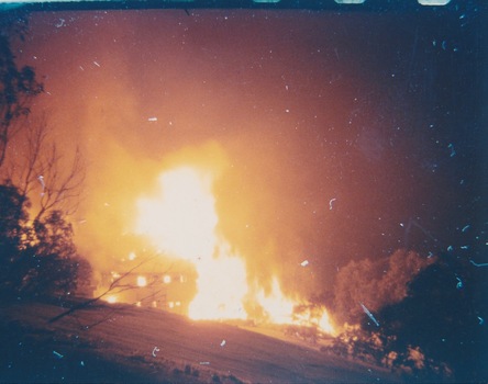 Photo of Grand Coeur Lodge on fire August 1961.