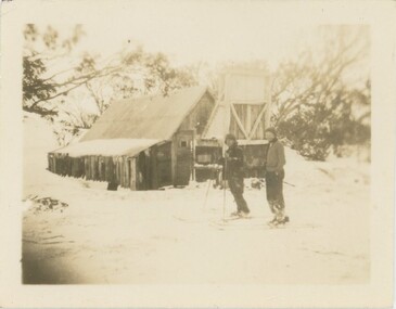 Two people on skis at Wallace's Hut