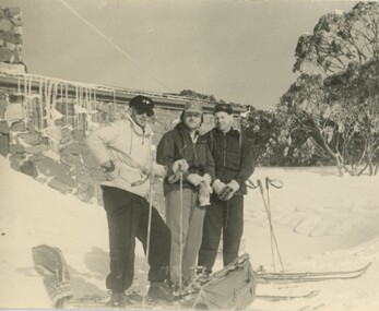 Three skiers outside Cleve Cole Lodge